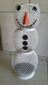 Empty snowman bird feeder