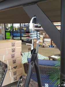 Hanging spring for patio swing
