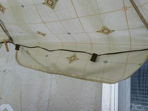 Installation of string lights on umbrella