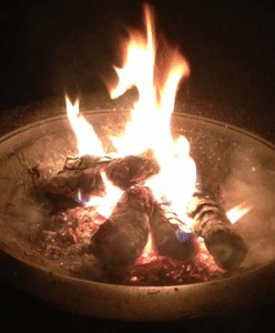 Wood fire in round fire pit