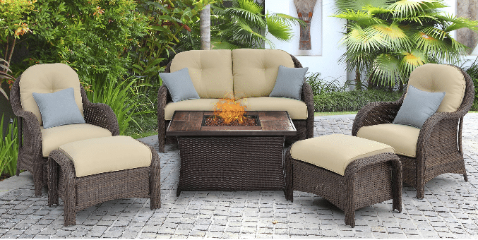 Newport resin wicker patio conversation set with cream cushions