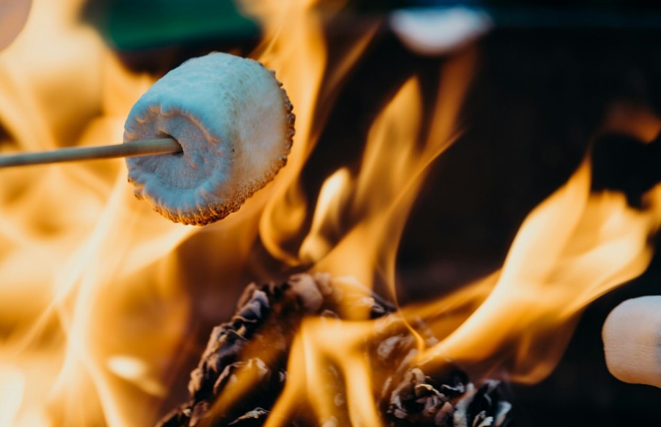 Roasting marshmallows over an open flame 